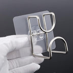 Transparent double loop adhesive wall hook installed on smooth wall