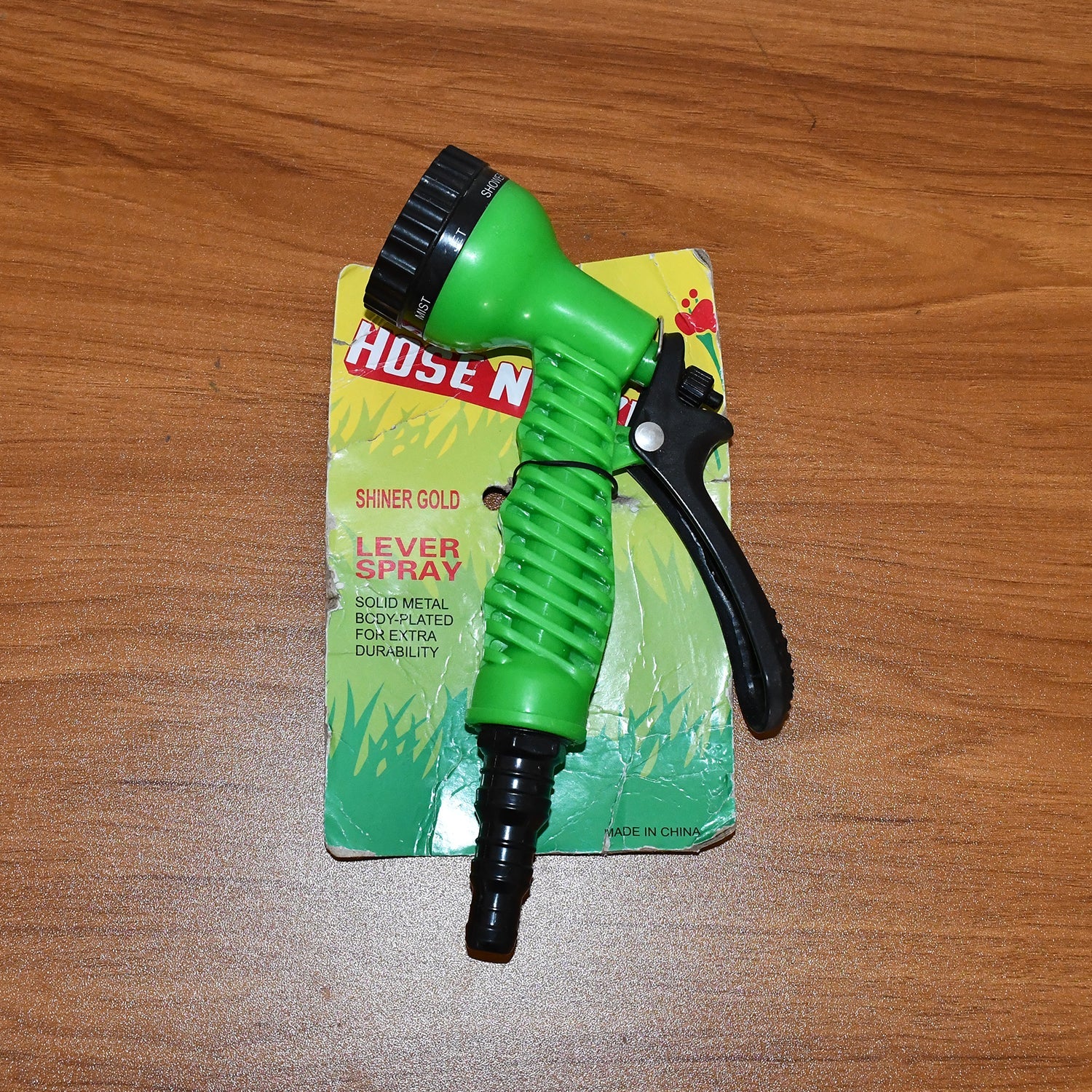 Demonstration of garden hose spray nozzle's multiple spray patterns in action