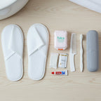 8 in 1 compact travel grooming kit including slippers, toothbrush, and comb