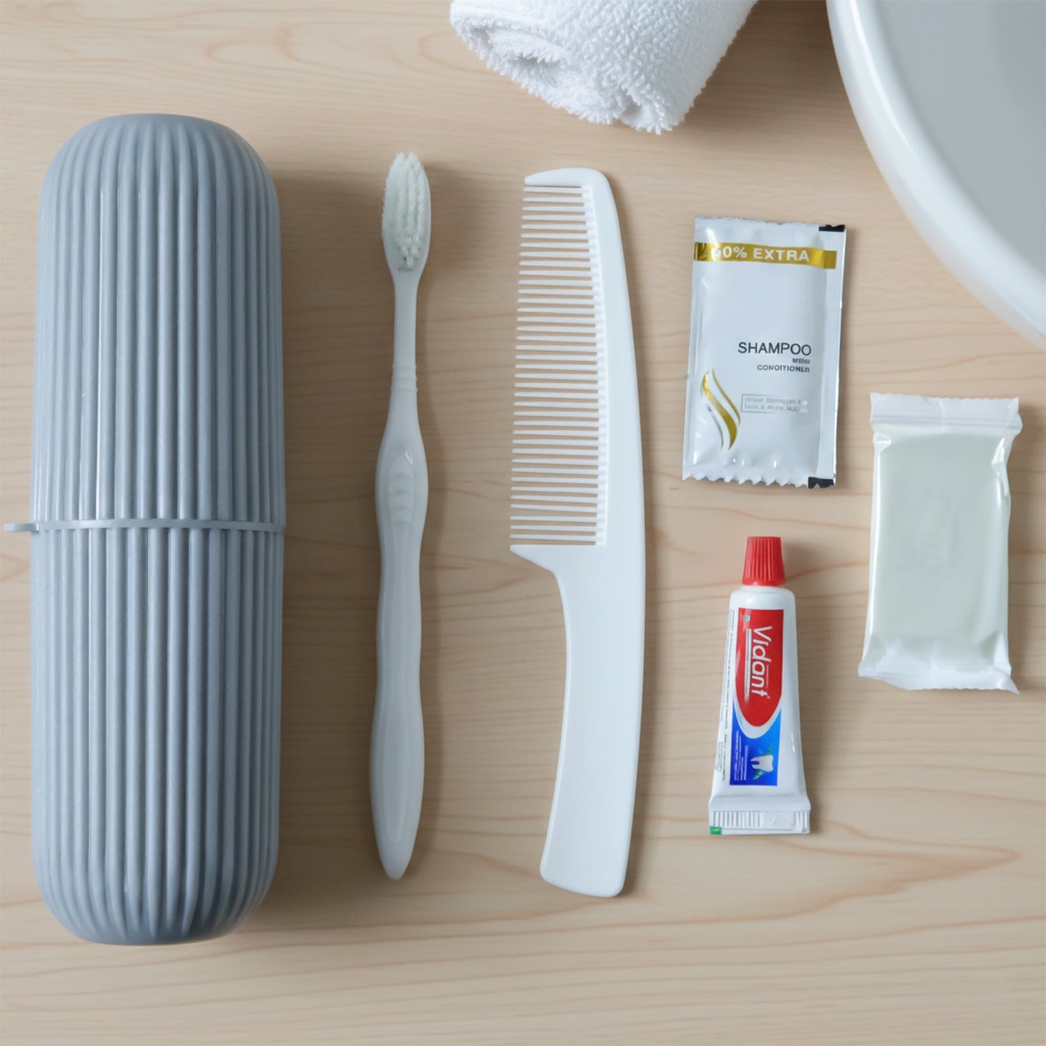 Travel grooming kit neatly packed showing slippers and toiletry essentials