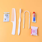 Hotel guest toiletry kit with toothbrush, soap and shampoo sachet
