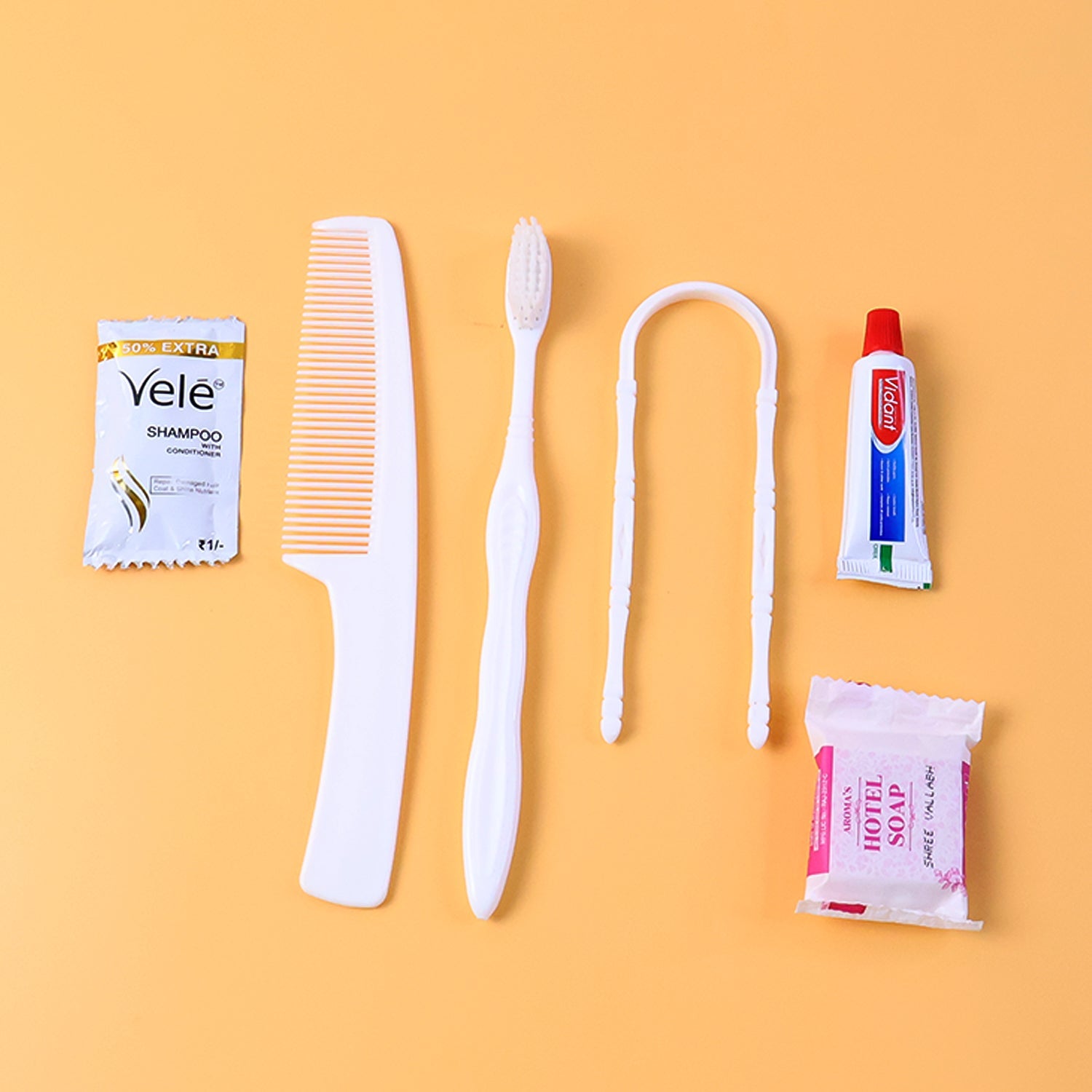 Hotel guest toiletry kit with toothbrush, soap and shampoo sachet