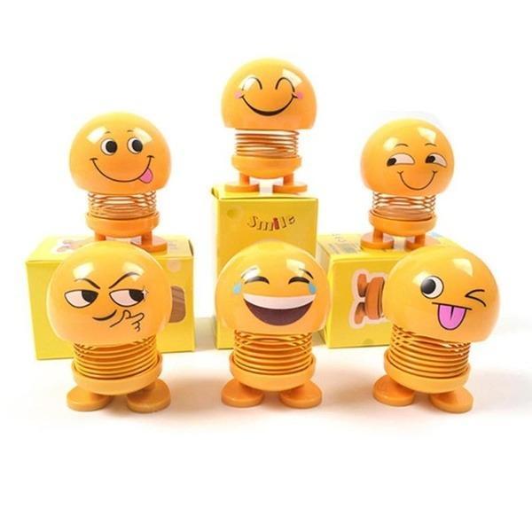 Collection of various smiling face spring toys, showcasing their playful design.