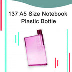 A slim plastic water bottle fitting perfectly into a bag, demonstrating its notebook-like portability.