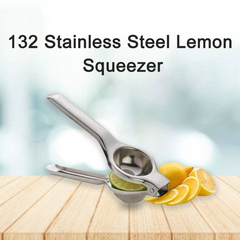 Freshly squeezed lemon juice being collected from the stainless steel squeezer.