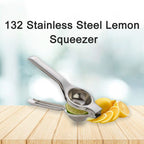 Freshly squeezed lemon juice being collected from the stainless steel squeezer.