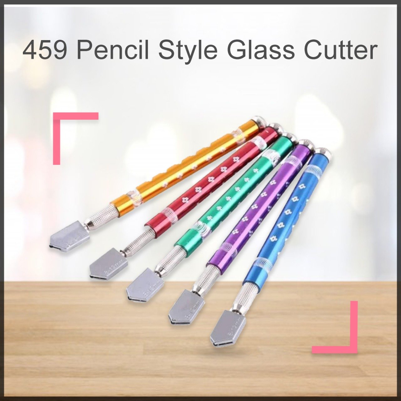 Hand holding the pencil-style glass cutter, ready for use.