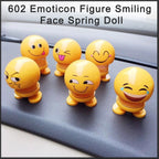 A smiling face spring doll displayed as a charming desk decor item.