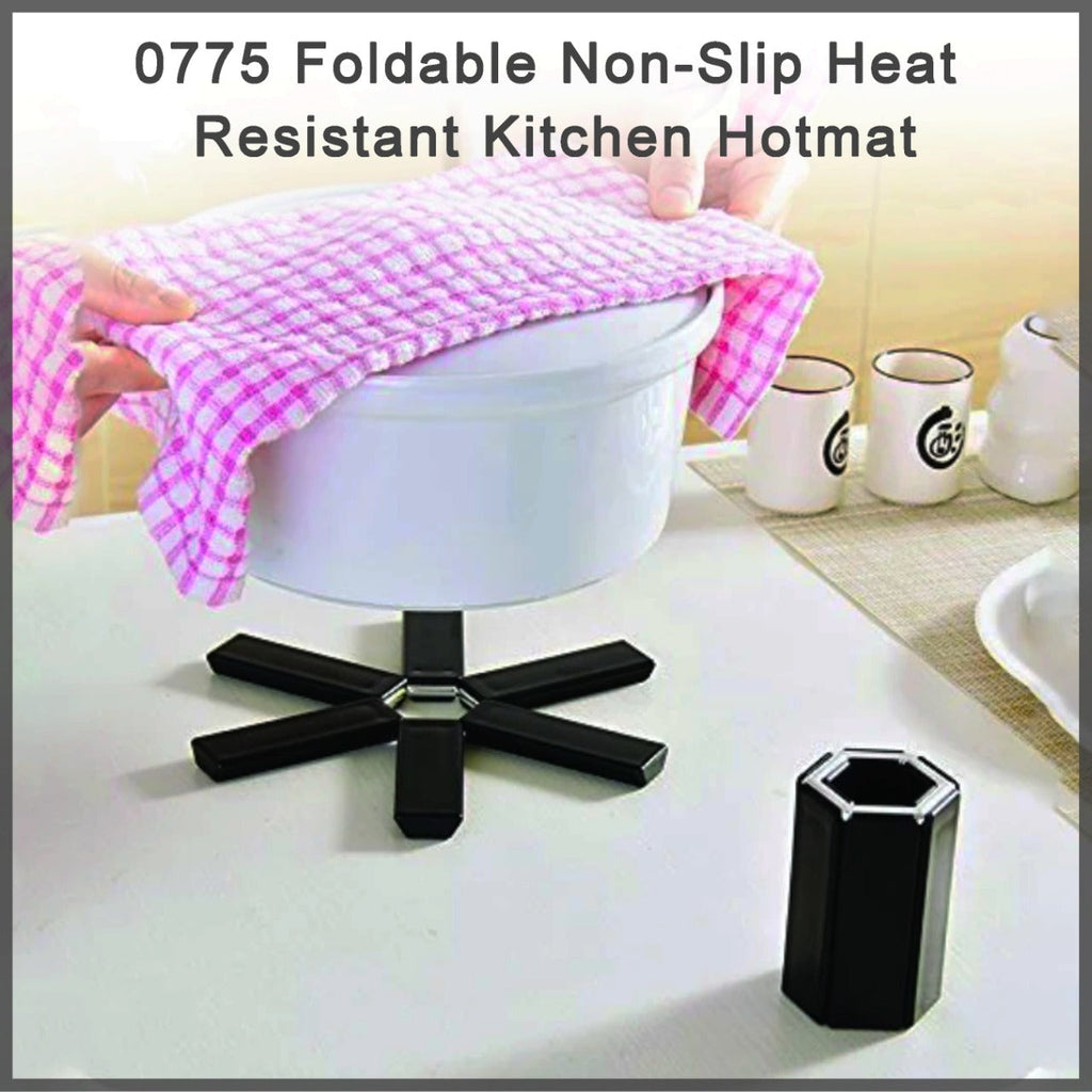 Foldable silicone hotmat protecting a kitchen counter from a hot pot.