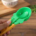 Ice cream scooper with ergonomic handle and a vibrant red scoop.