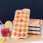 Empty plastic ice cube tray showing diamond-shaped molds