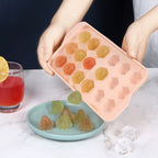 Frozen diamond-shaped ice cubes popped out of plastic tray