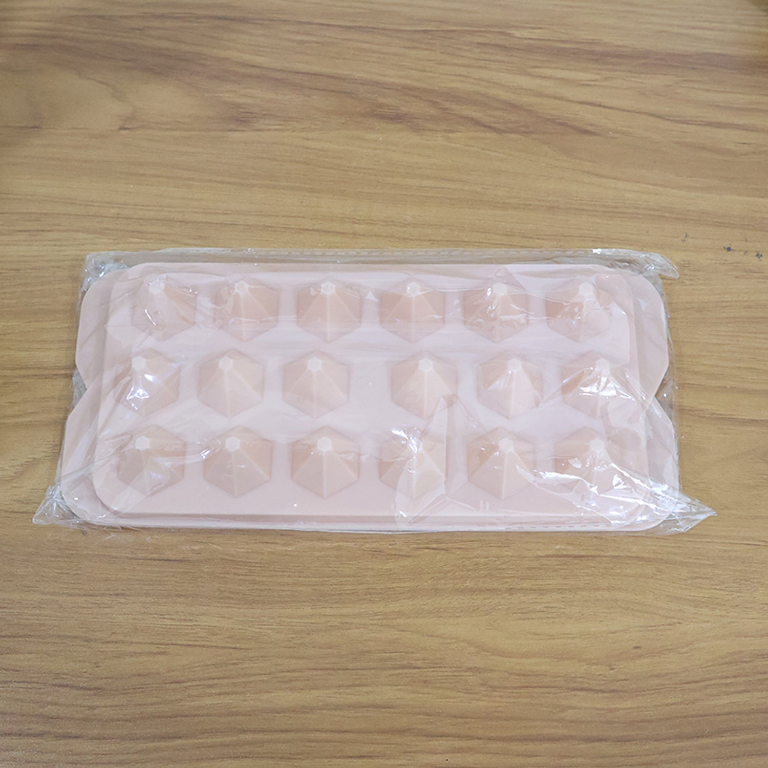 Ready to serve diamond-shaped ice cubes from plastic tray