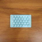 Blue plastic candy shaper for easy DIY lollipops