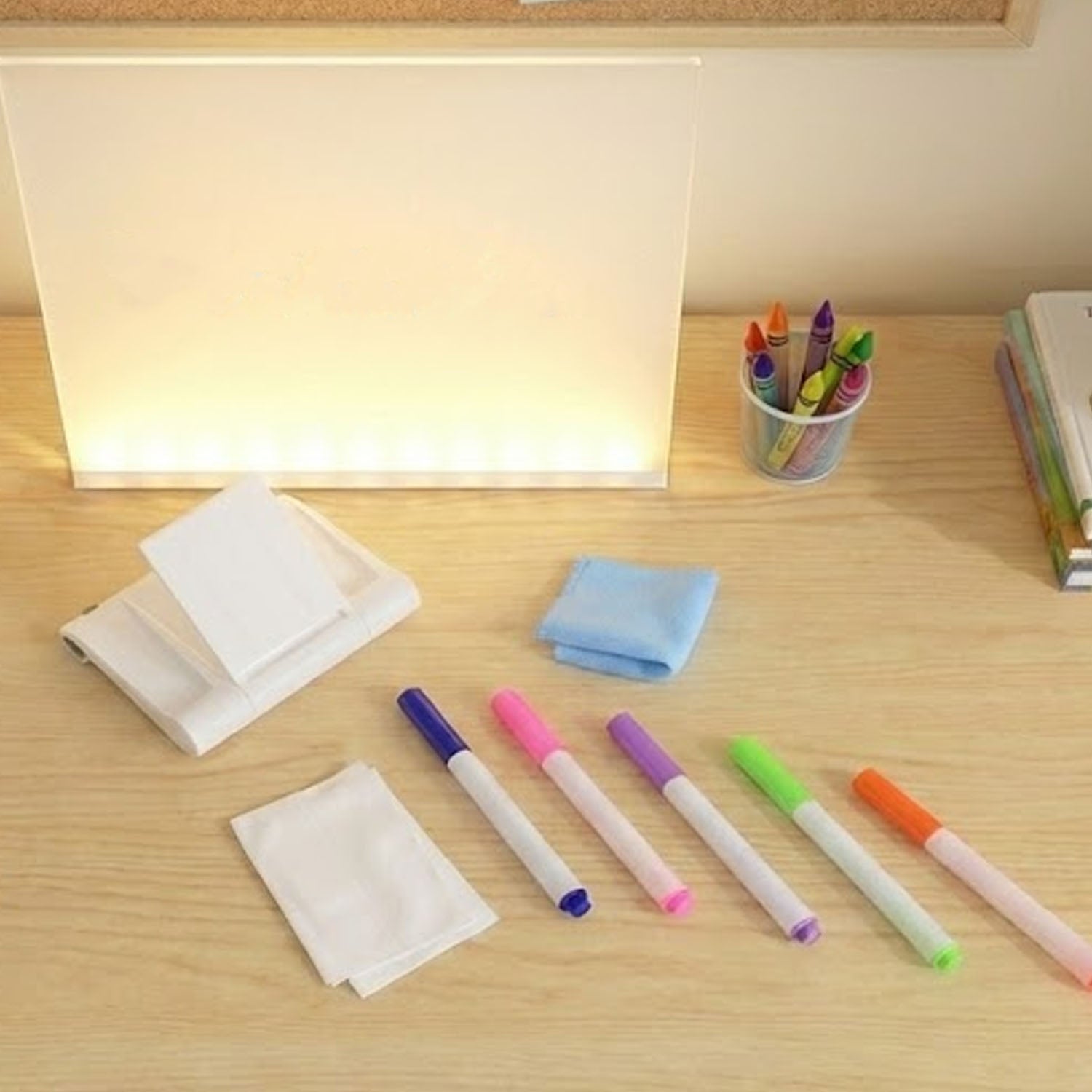 LED writing board placed on desk showing clear messages