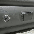 Portable inflatable bed partially folded illustrating compact and lightweight design