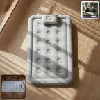Portable inflatable bed folded for storage with easy carrying handle