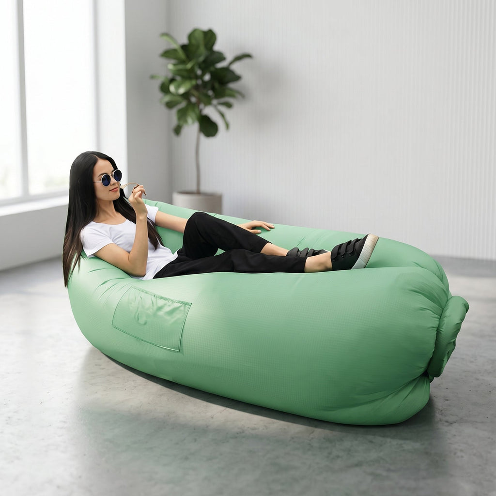 Green inflatable air sofa for outdoor lounging and relaxation