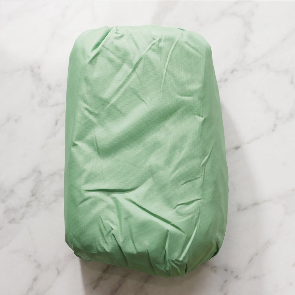 Unfolded inflatable air sofa on grass for outdoor lounging