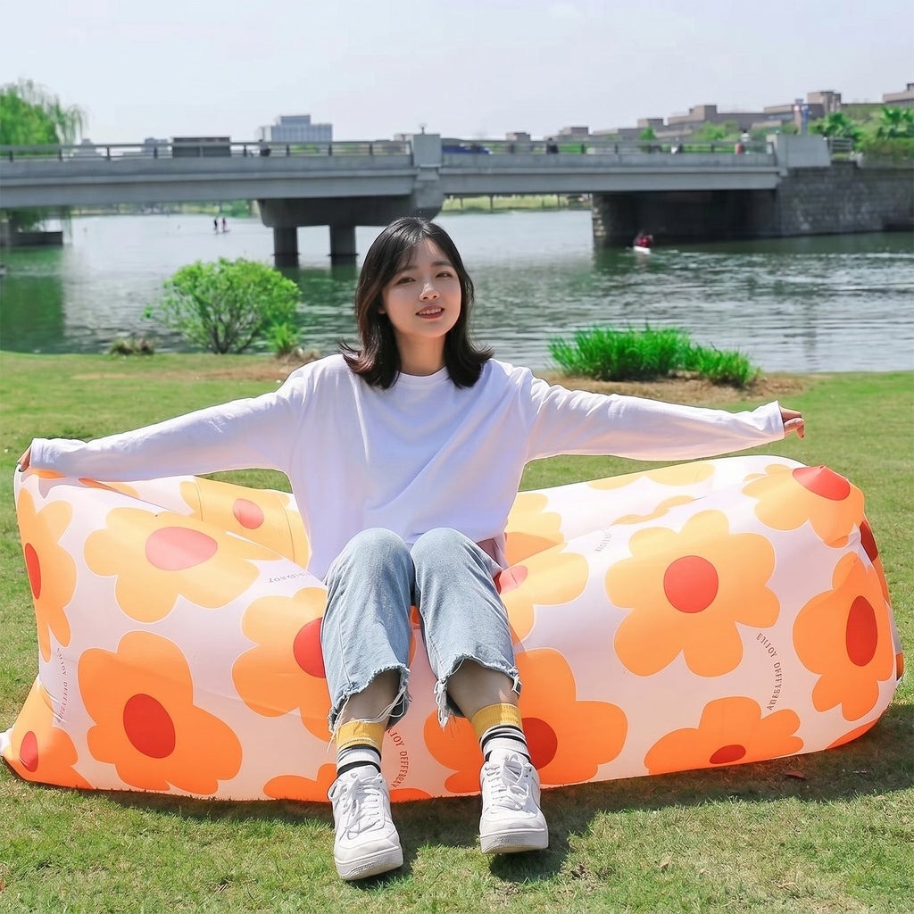 Floral air-filled inflatable lounge chair, ideal for outdoor lounging