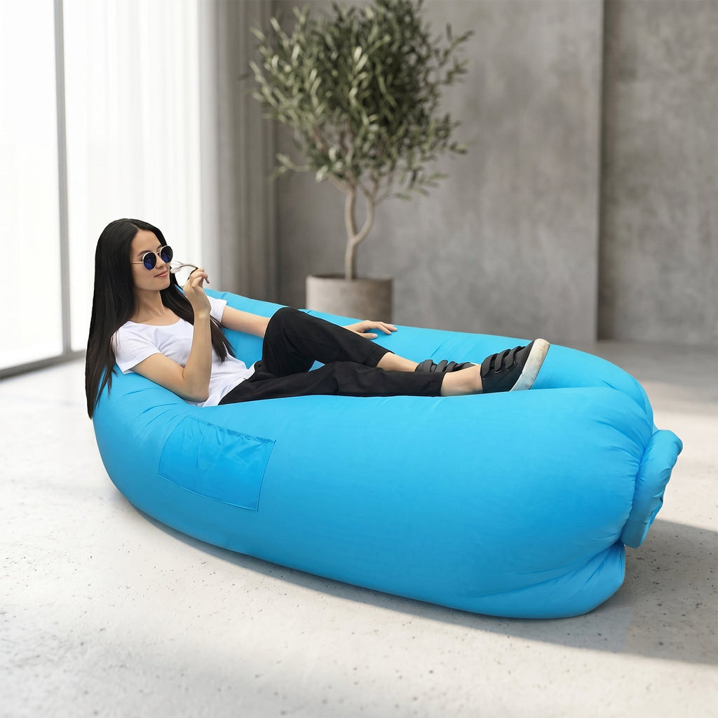 Blue inflatable air sofa set up in scenic outdoor landscape