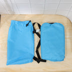 Lifestyle shot of blue inflatable lounger in natural outdoor setting