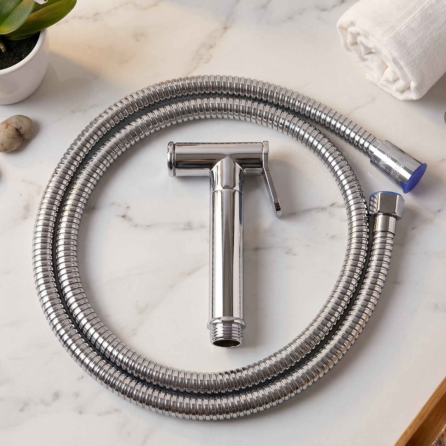 Close-up of brass Shattaf faucet showing chrome finish