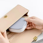 Open view showing compartments of plastic jewelry box