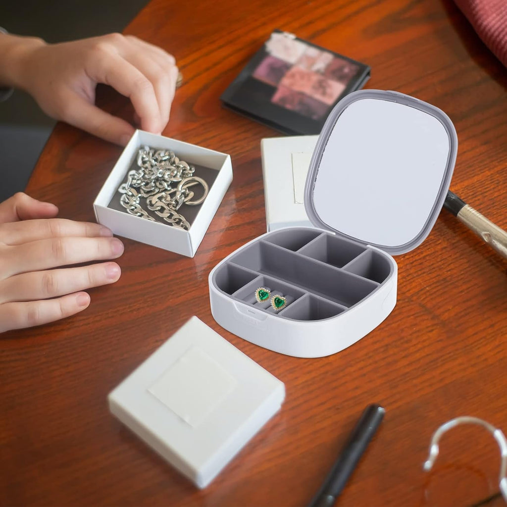 Plastic jewelry storage box displayed with assorted jewelry