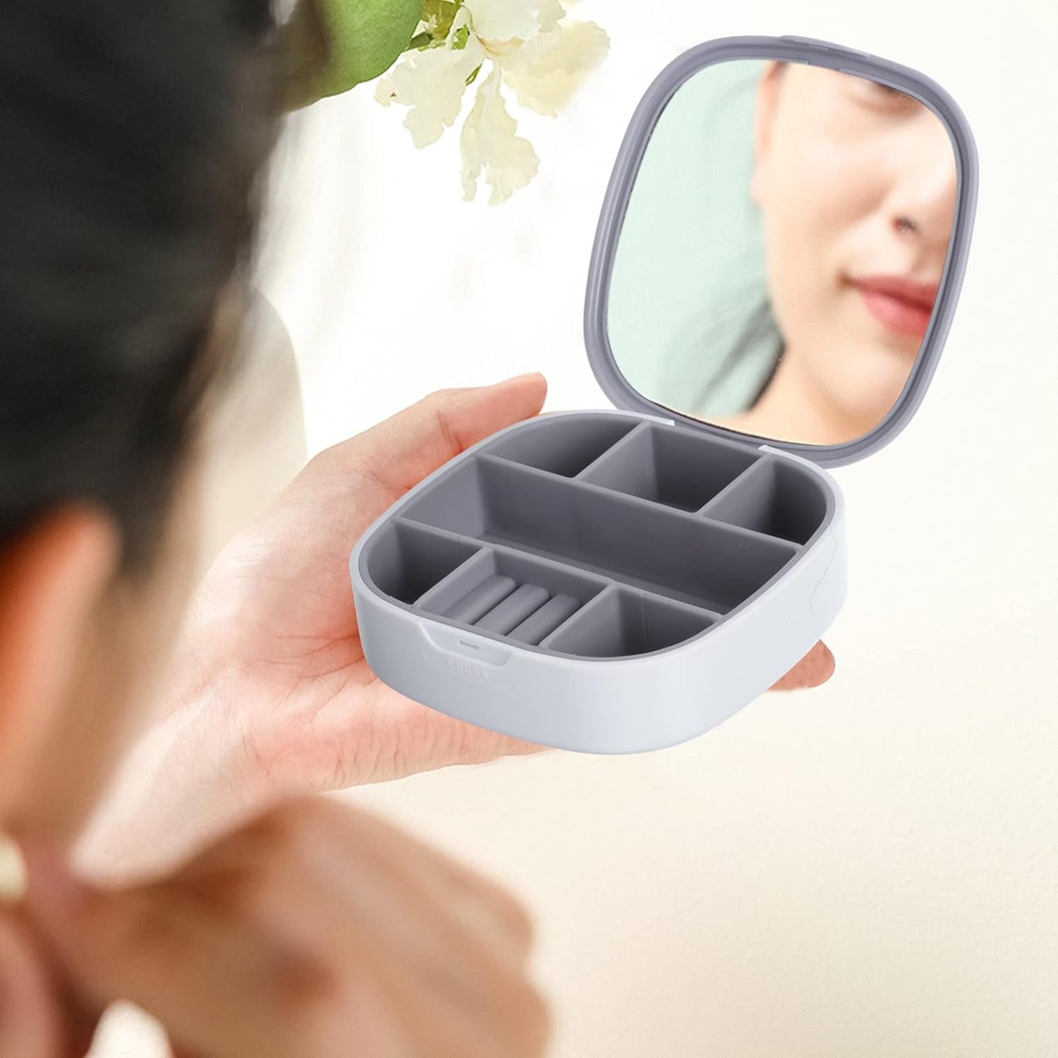 Jewelry organizer with compartments and secure closure