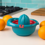Built-in spout of manual citrus juicer allowing mess-free pouring of juice