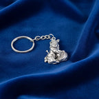 Detailed front-facing view of silver Bal Krishna Makhan Chor keychain