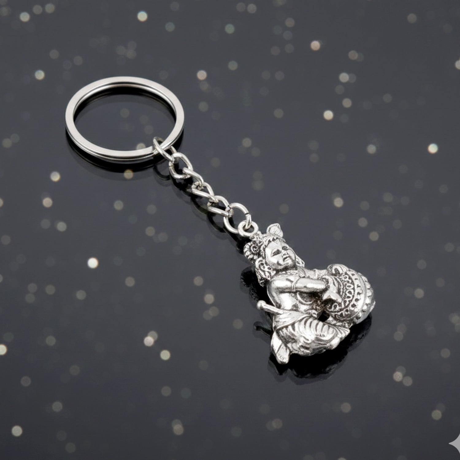 Side profile of Bal Krishna Makhan Chor silver metal keychain