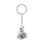 Bal Krishna Makhan Chor keychain displayed against a wooden backdrop