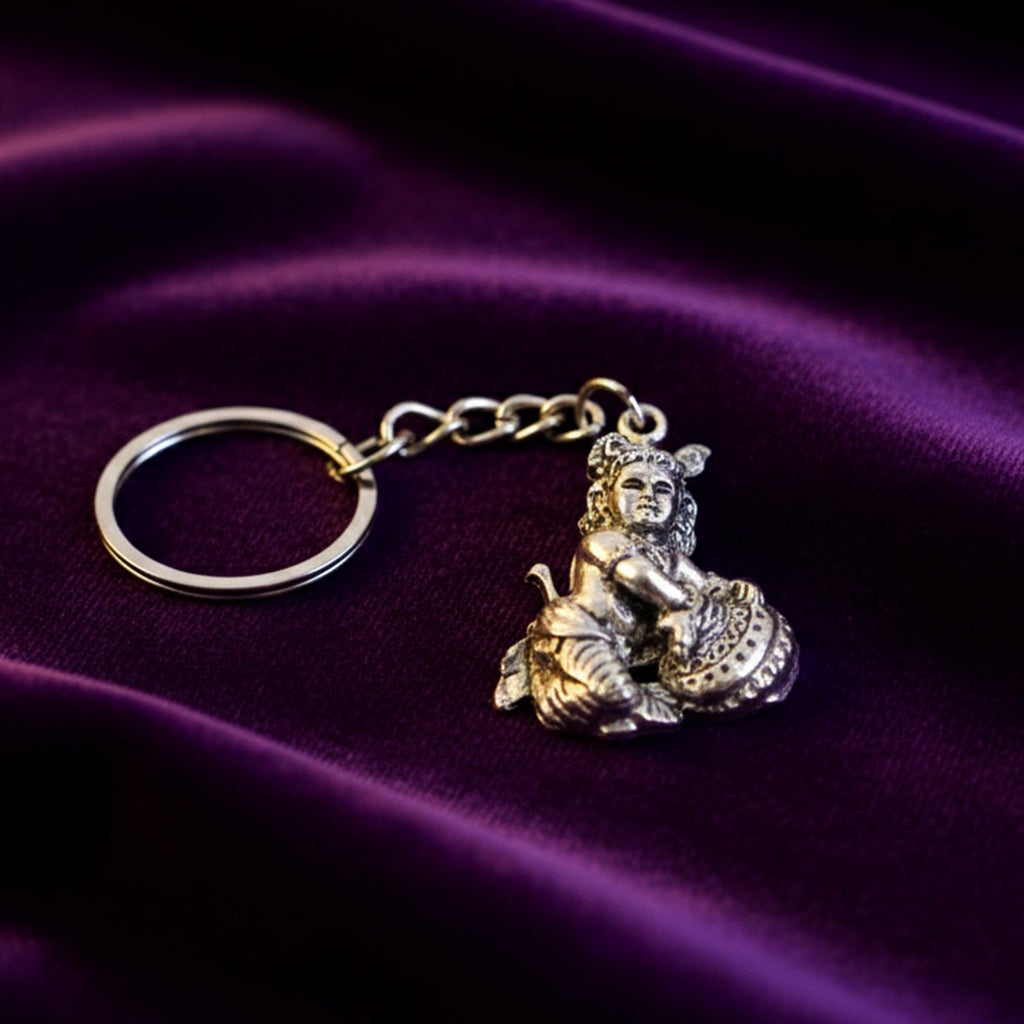 Bal Krishna Makhan Chor keychain attached to a set of everyday keys