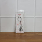 Bal Krishna Makhan Chor keychain attached to vehicle keys adding a spiritual charm