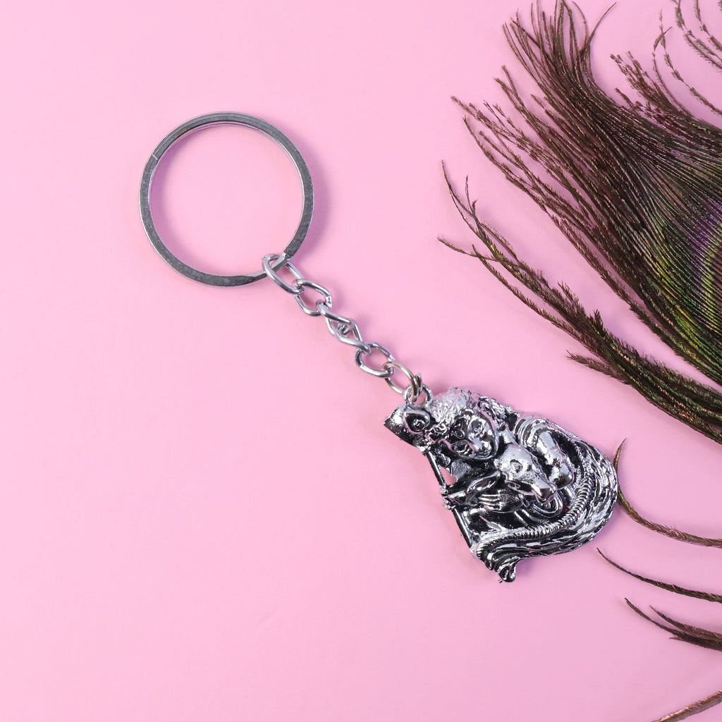 Silver finish Bal Krishna metal keychain hanging on a key ring accessory