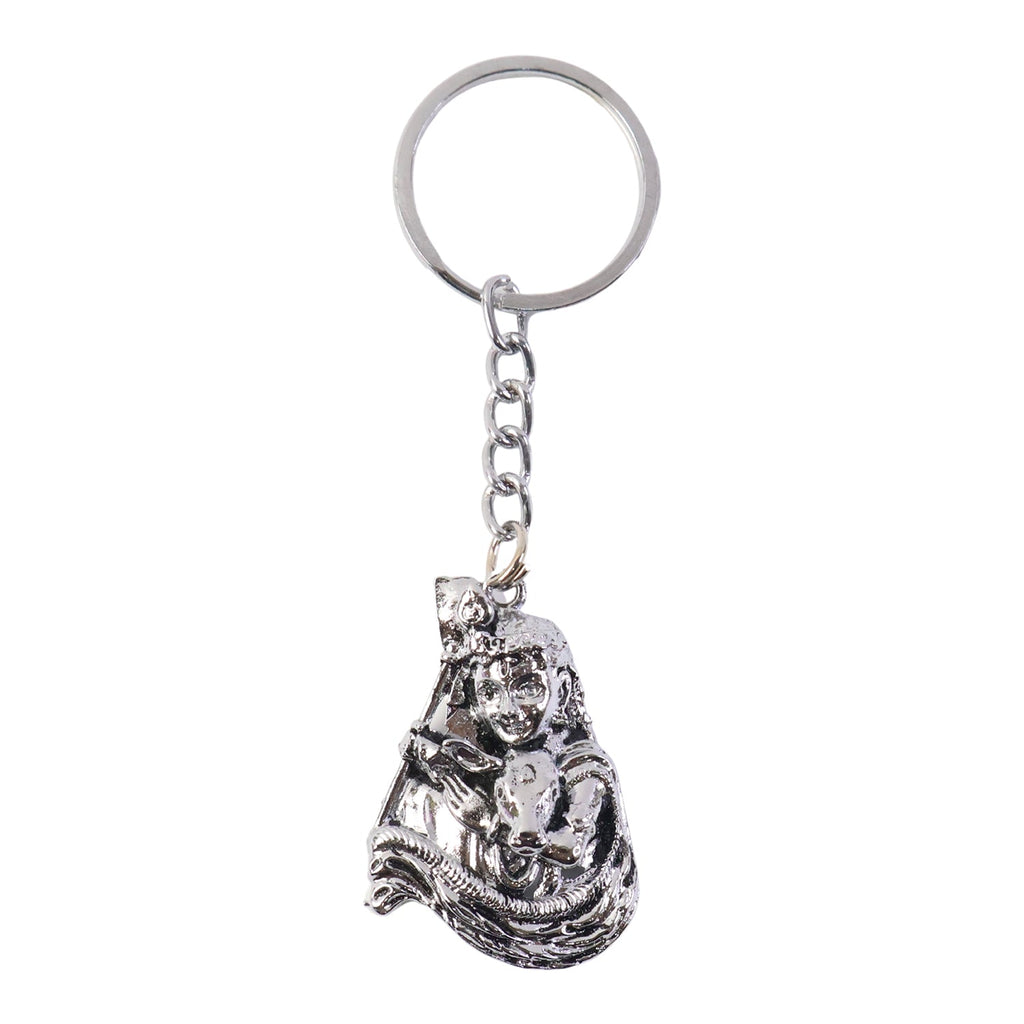 Front view of silver finish Bal Krishna metal keychain highlighting ornate details