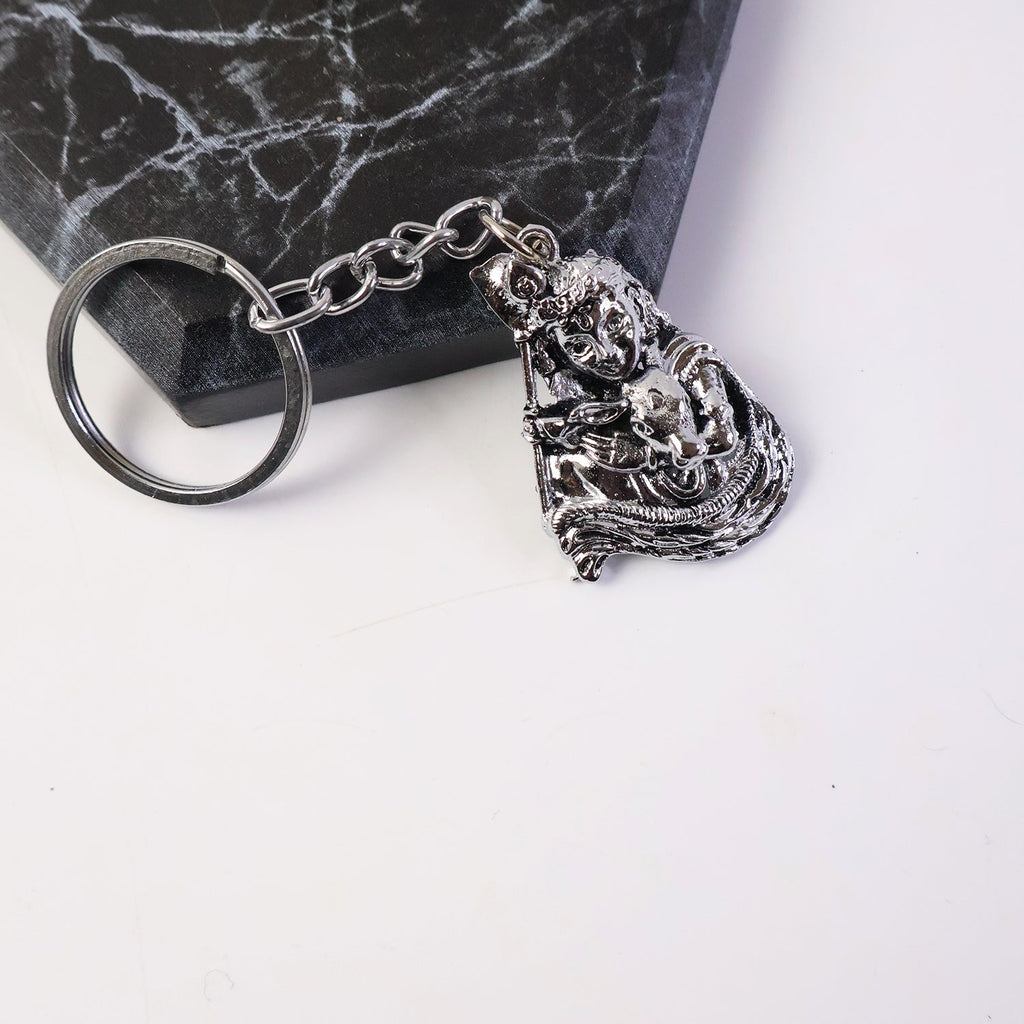 Silver finish metal keychain featuring Bal Krishna idol with sturdy chain and ring
