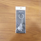 Lifestyle image of silver finish Bal Krishna keychain attached to car keys