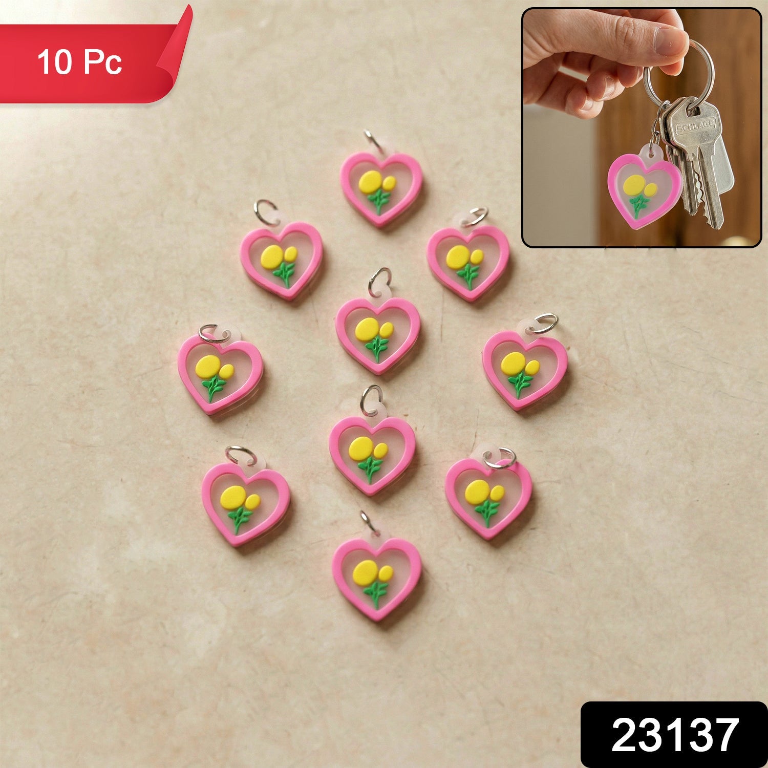 Cute heart flower keychain on pink background