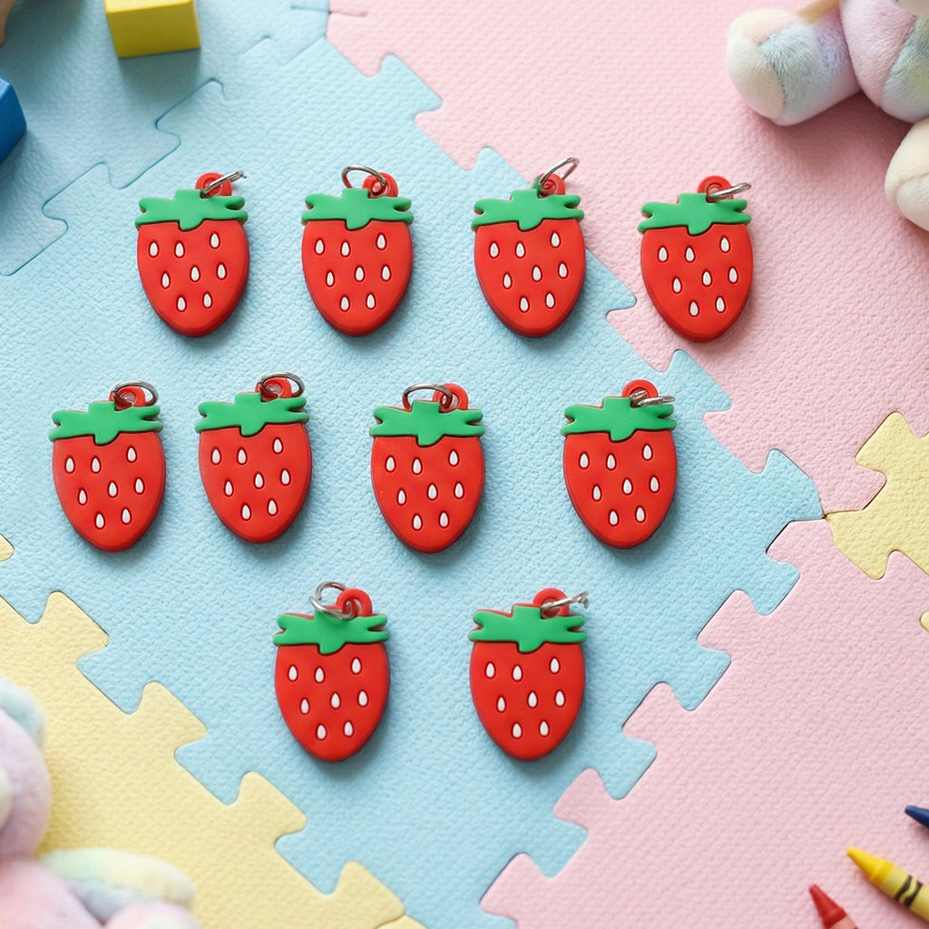Set of decorative strawberry bag charms and keychains