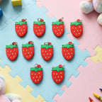 Set of decorative strawberry bag charms and keychains