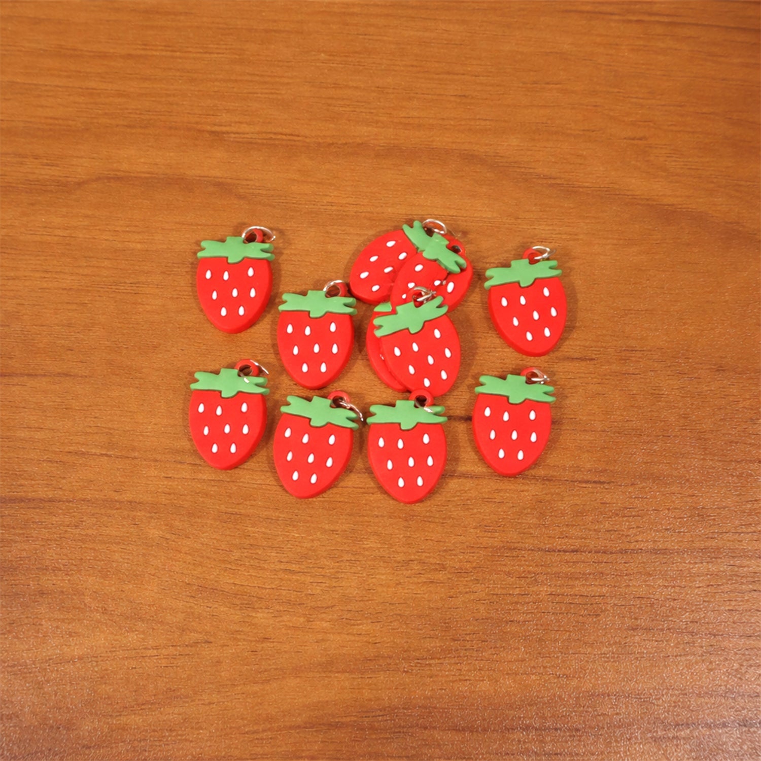 Colorful set of strawberry-themed keychain accessories