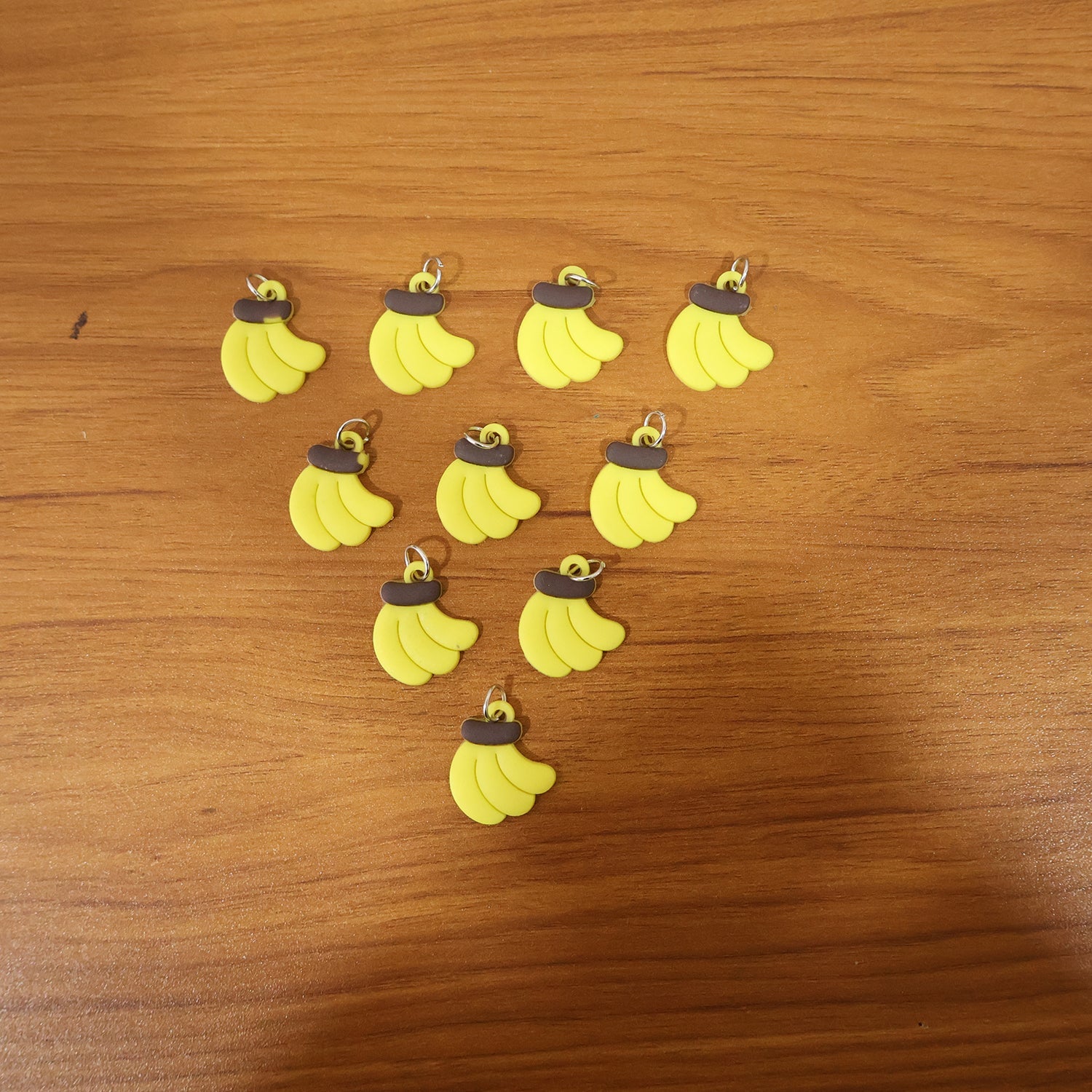 Assorted banana-shaped bag charms in set