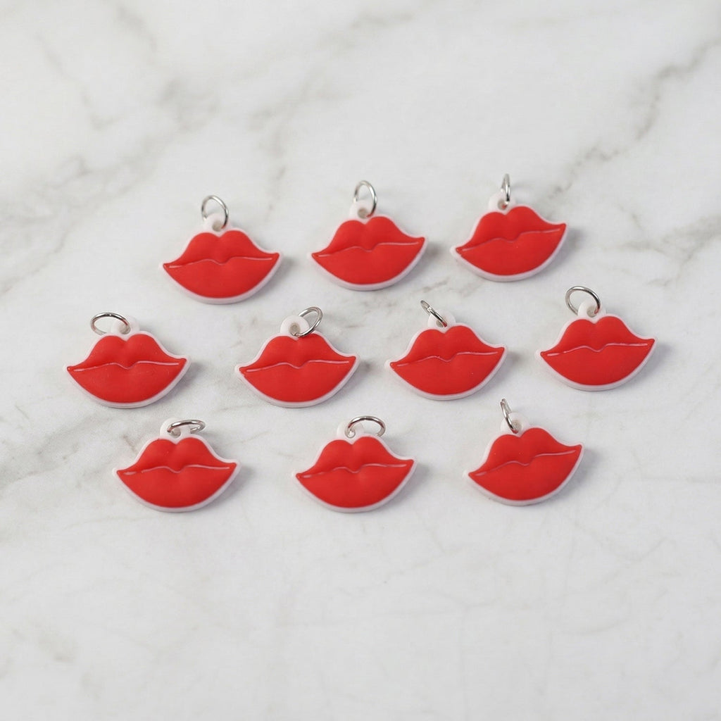 Close-up of vibrant red lips bag charm on a purse