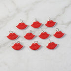 Close-up of vibrant red lips bag charm on a purse