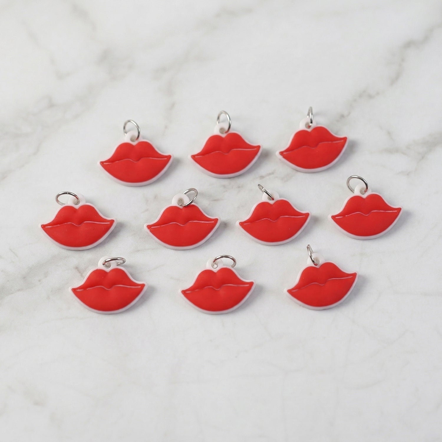 Close-up of vibrant red lips bag charm on a purse