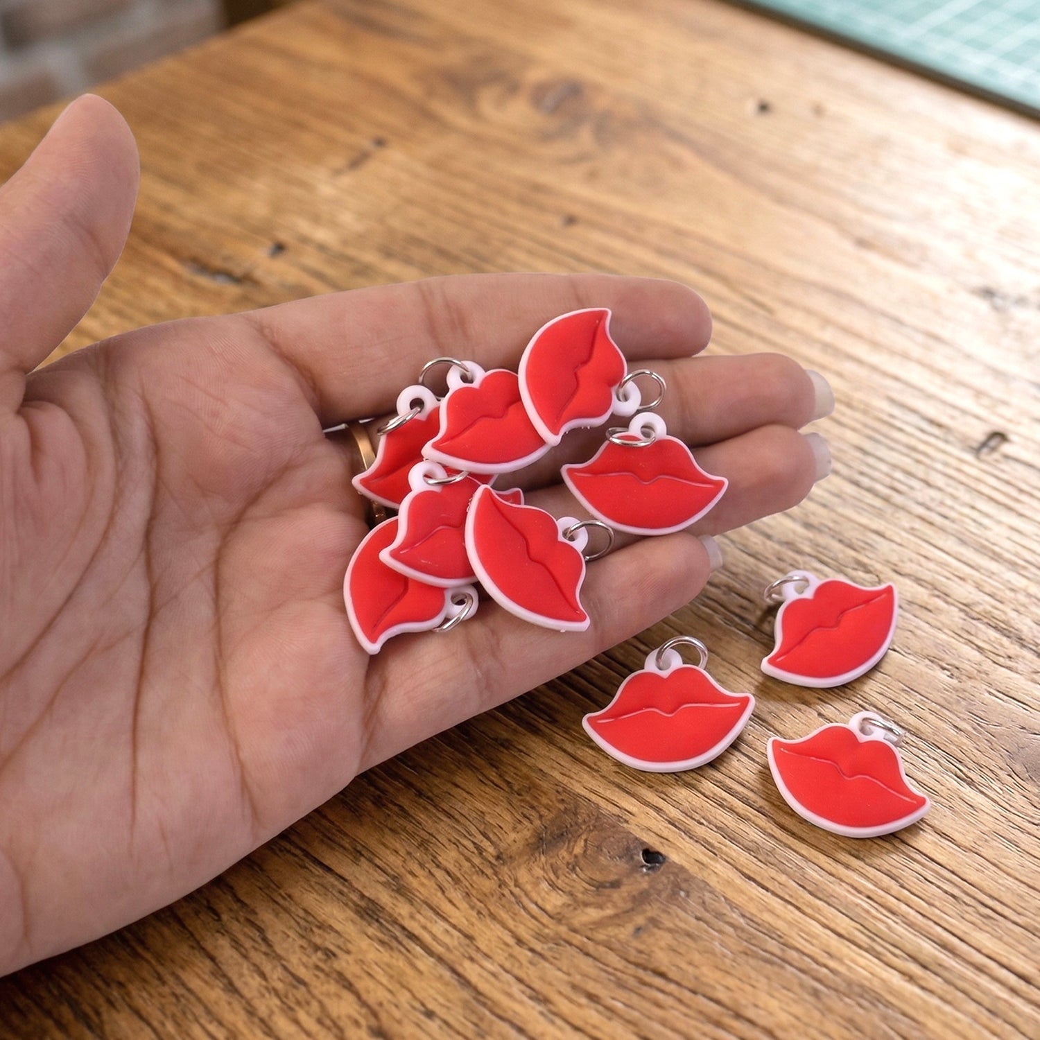 Set of fashionable lips bag charms and keyrings displayed together