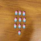 Display of ice cream bag charms on surface for accessories